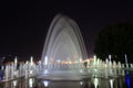 Picturesque, beautiful big fountain at night against dark sky. Evening view of Dnipro city, Dnepropetrovsk, Ukraine. Creative Royalty Free Stock Photo