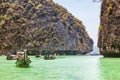 A picturesque beautiful place on the island of Phi Phi Leh - Pi Leh Lagoon is popular for excursions with tourists on traditional