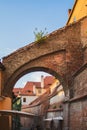 Picturesque brick alleyway leading to an antiquated building complex