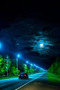 A picturesque, bright, colorful night landscape with a highway