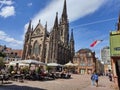 The picturesque building of Mulhouse town hall and its gothic cathedral.