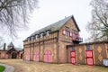 Picturesque coach houses and horse stables at a castle square Royalty Free Stock Photo