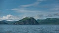 The picturesque coast of Kamchatka against the background of blue sky and clouds Royalty Free Stock Photo
