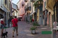 Picturesque cobbled alley with traditional restaurants, Luino, Italy Royalty Free Stock Photo