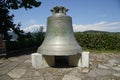 Picturesque cobblestone pathway in Carinthia, Austria,with a large antique bell perched atop