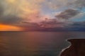 Picturesque colorful bright sunrise or sunset over Mediterranean Sea calm tranquil smooth waters. Fluffy clouds on morning or