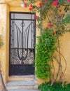 Picturesque colorful house facade and rose flowers Athens Greece, Anafiotika neighborhood Royalty Free Stock Photo