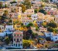 Picturesque colorful houses , similar to puppet. Symi island, Greece Royalty Free Stock Photo