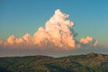 Picturesque cumulus storm cloud in the sky. Sunset colors.