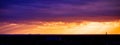 Picturesque dramatic panorama of sunset sky over dark flat skyline Royalty Free Stock Photo