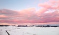 Picturesque drone view of the sunset over a snow covered mountain valley. Winter landscape from a bird`s-eye view Royalty Free Stock Photo