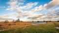 Picturesque Dutch polder landscape with white clouds against a blue sky Royalty Free Stock Photo
