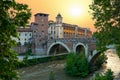 Picturesque evening cityscape of the Tiber river, Fabrizio bridge and Castello Caetani Castle in Rome at sunset