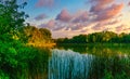 Picturesque evening nature landscape by the lake with dramatic sky