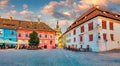 Picturesque evening view of famous medieval fortified city and the Clock Tower built by Saxons. Splendid summer cityscape of Sigh