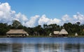 Picturesque and exotic lagoon with clean water El Milagro, loggon milagros with wooden house and thatched roof stilt houses Amazon Royalty Free Stock Photo