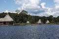 Picturesque and exotic lagoon with clean water El Milagro, loggon milagros with wooden house and thatched roof stilt houses Amazon Royalty Free Stock Photo