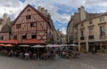 Picturesque French outdoor cafe in the historic old town of Dijon with half-timbered houses behind Royalty Free Stock Photo