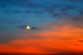 Picturesque Full moon on a background of beautiful blue and red clouds. Clouds at sunset, sunrise during the full moon. Cloud Royalty Free Stock Photo