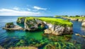 Picturesque golf course on cliff edge with rock arches and stunning ocean scenery