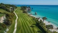 Picturesque golf course on white cliffs with iconic rock arches and stunning ocean vista