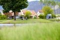 Picturesque. Golfers sitting in a golf cart on a the course in front of the club house. Royalty Free Stock Photo