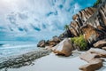 Picturesque granite boulders formation on tropical white sand beach Grand Anse, La Digue island, Seychelles Royalty Free Stock Photo