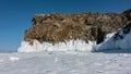 A picturesque granite rock, devoid of vegetation, against the backdrop of a blue sky.