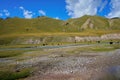 Picturesque hills and yaks grazed in a distance