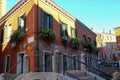 Picturesque house with flowers in historic centre of Venice, Italy