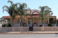 Picturesque house with veranda and palm trees in Western Australia