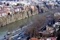 Beautiful view on top of the house on the edge of the cliff of the Kura river in Tbilisi Royalty Free Stock Photo