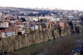 Beautiful view on top of the house on the edge of the cliff of the Kura river in Tbilisi Royalty Free Stock Photo