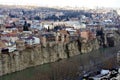 Beautiful view on top of the house on the edge of the cliff of the Kura river in Tbilisi Royalty Free Stock Photo