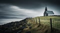 Icelandic style church sits in fenced field, in windswept landscape