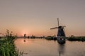 Picturesque Image of Historic Dutch Windmills In Front of The Canal Royalty Free Stock Photo