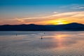 Picturesque lake at sunset where yachts sail Royalty Free Stock Photo