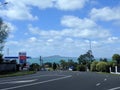 Picturesque landscape with asphalt road, blue sea and Rangitoto Island on background, Auckland, New Zealand Royalty Free Stock Photo