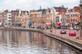 Picturesque landscape with beautiful traditional houses reflection in canal, Haarlem, Holland