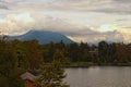 Picturesque landscape of Bled village. Majestic mountains in stormy clouds in the background. Royalty Free Stock Photo