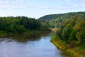 Picturesque landscape of deep river and european mixed forest