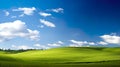 picturesque landscape features lush green hills stretching beneath clear blue skies