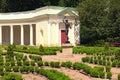 Picturesque landscape photo of the decorative architectural building called Echo colonnade and sculpture of Mercury the Roman God Royalty Free Stock Photo