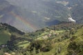 Picturesque landscape with rainbow over mountains in a sunny day Royalty Free Stock Photo