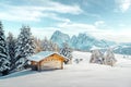 Picturesque landscape with small wooden house on meadow Alpe di Siusi