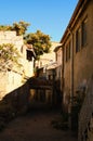 Picturesque landscape view of ancient narrow street in medieval Turkish city Avanos. Nice terrace between two stone houses