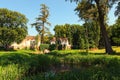 Picturesque landscape view of ancient ruins with small waterfall and pond in Alexandria park in Bila Tserkva, Ukraine