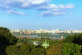 Picturesque landscape view of ancient Vydubychi Monastery, Dnipro River and construction of high-rise houses Royalty Free Stock Photo