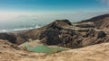 A picturesque lifeless acid lake in the crater of the Gorely volcano. Royalty Free Stock Photo