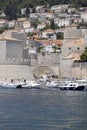 Picturesque medieval Old Port by Adriatic Sea with moored ships and Revelin Fort, Dubrovnik, Croatia